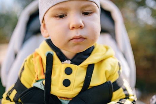 happy baby in a colorful cloth diaper