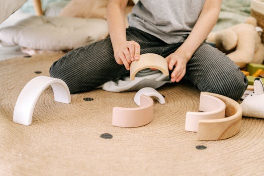 a child playing with wooden toys