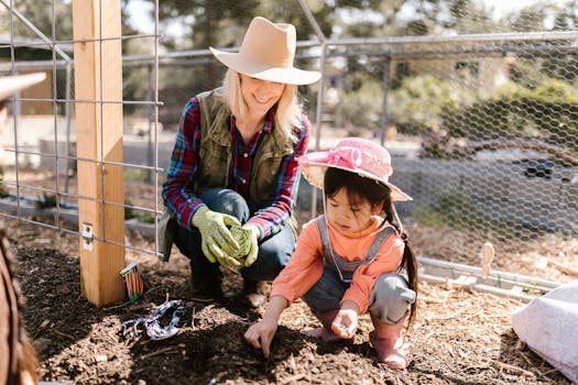 family planting seeds together in garden