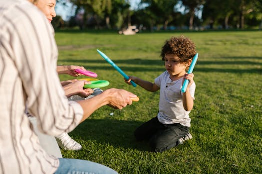 kids playing frisbee in a park